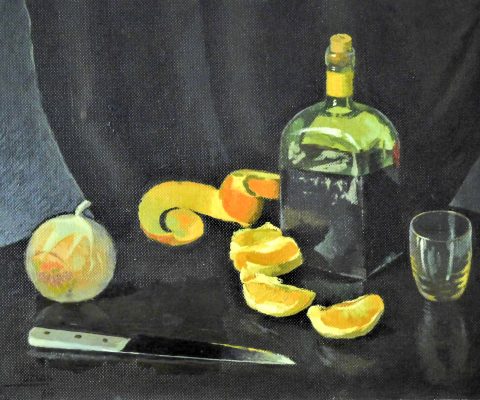 Botella de licor y naranjas